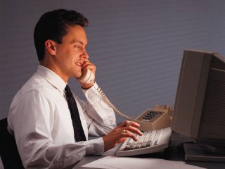 Business man in front of a computer